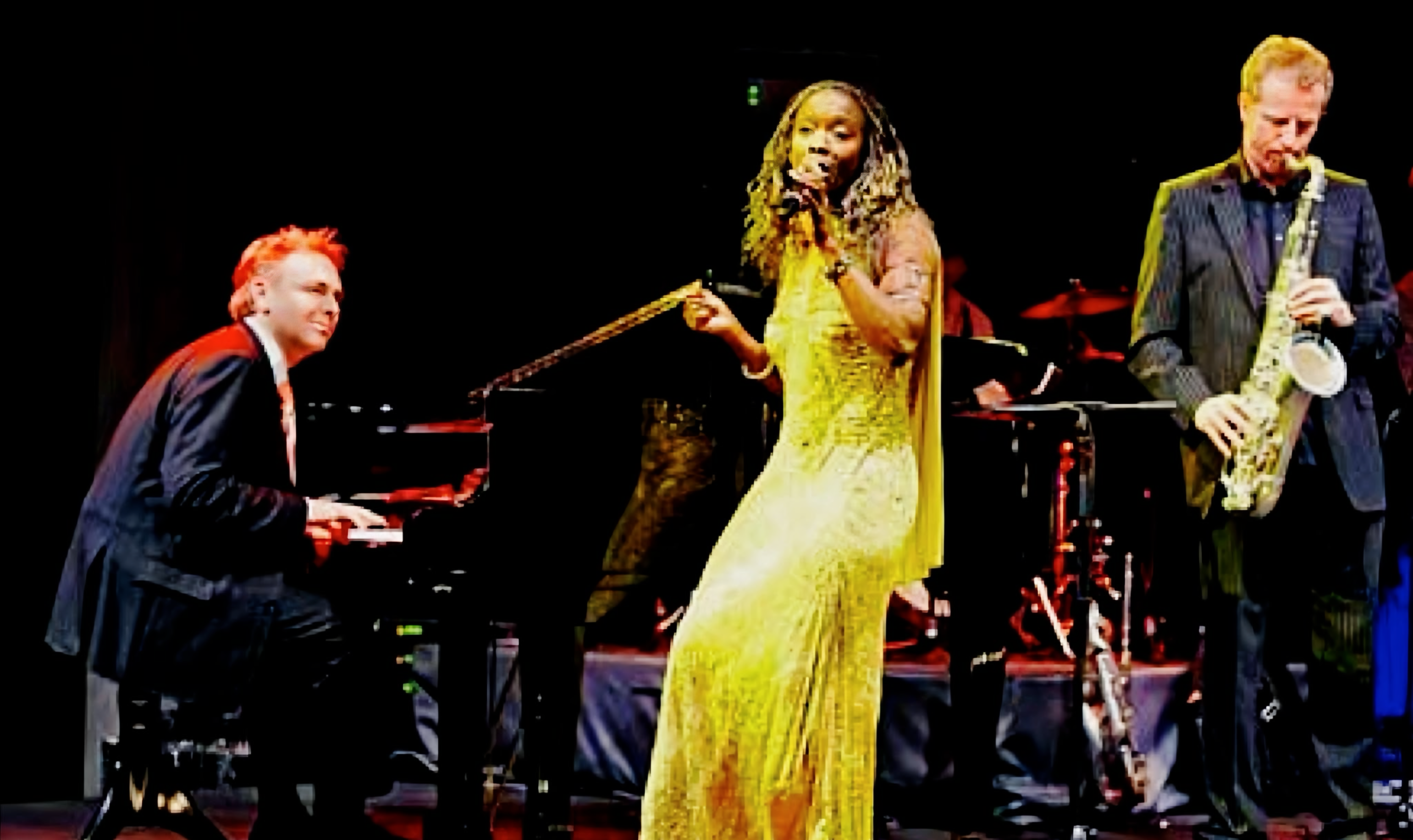 Kevin Forbes with Zeeteah Massiah and saxophonist at Hotel Adlon